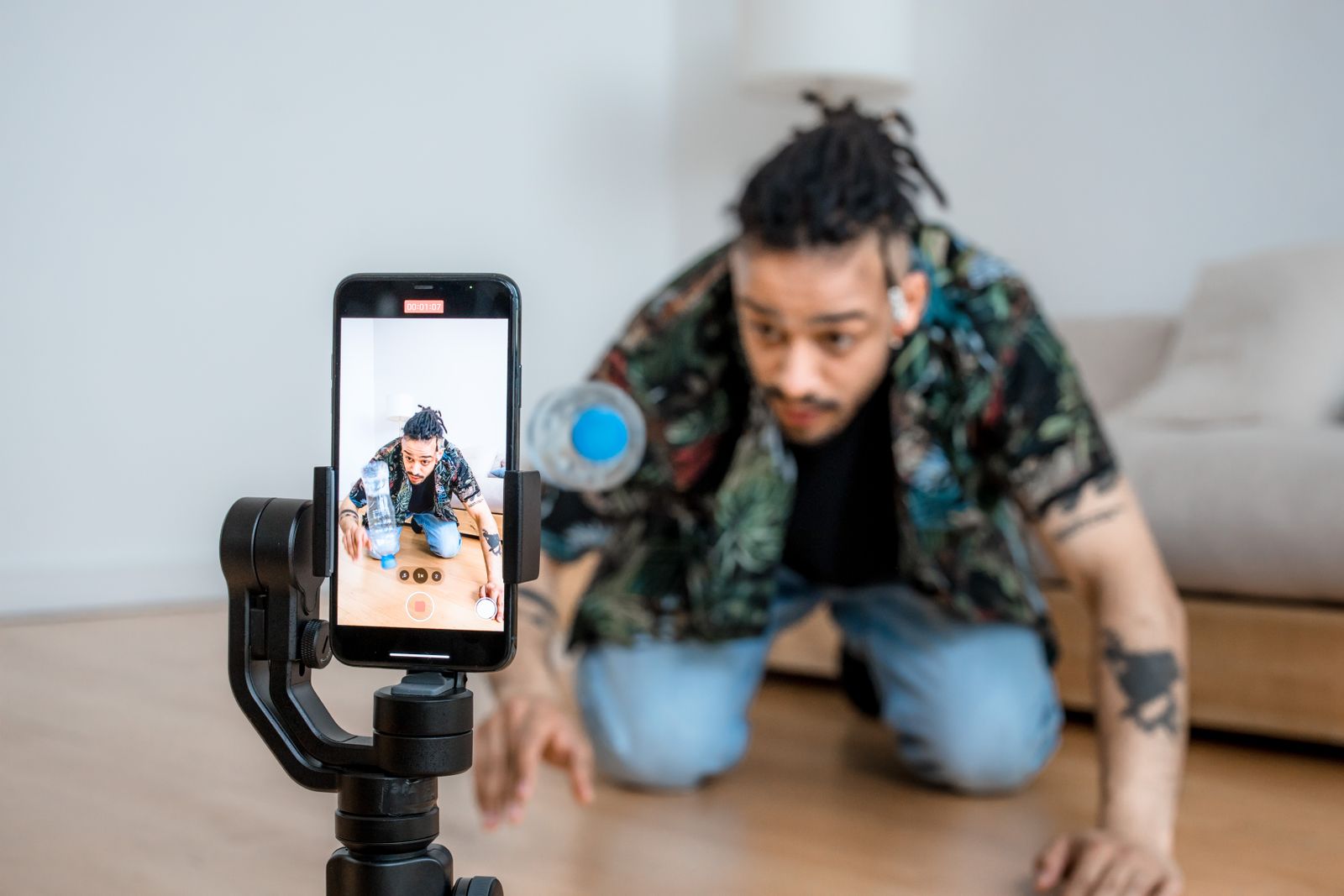 Creator filming short form video content on a phone mounted to a gimbal